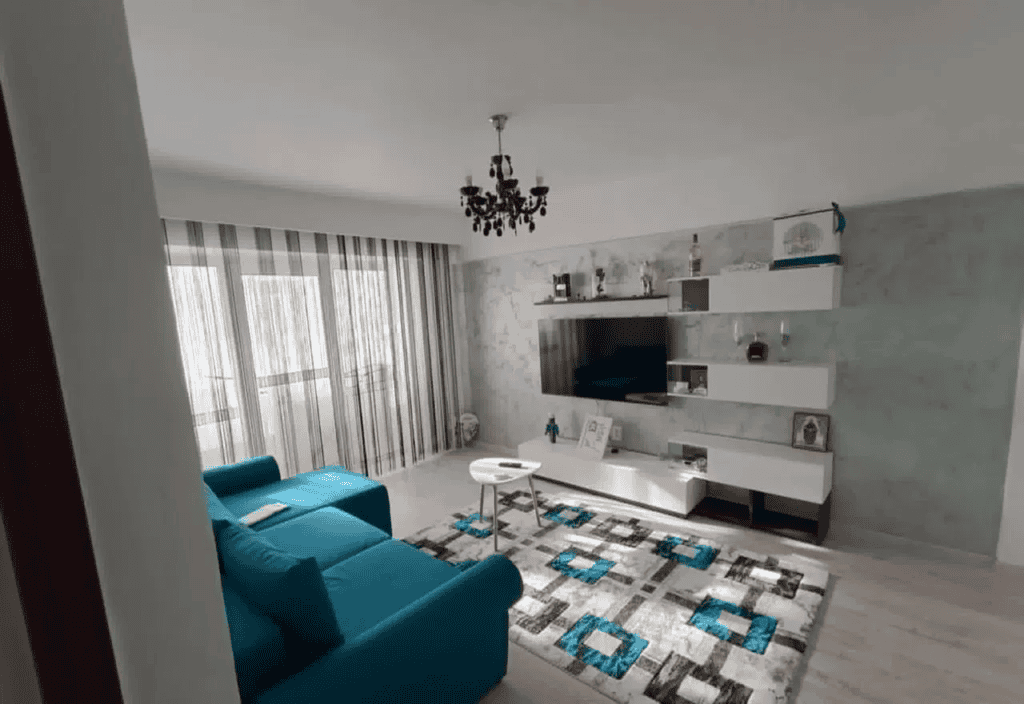 Apartament modern cu living spațios și mobilier elegant, ideal pentru confort și relaxare.