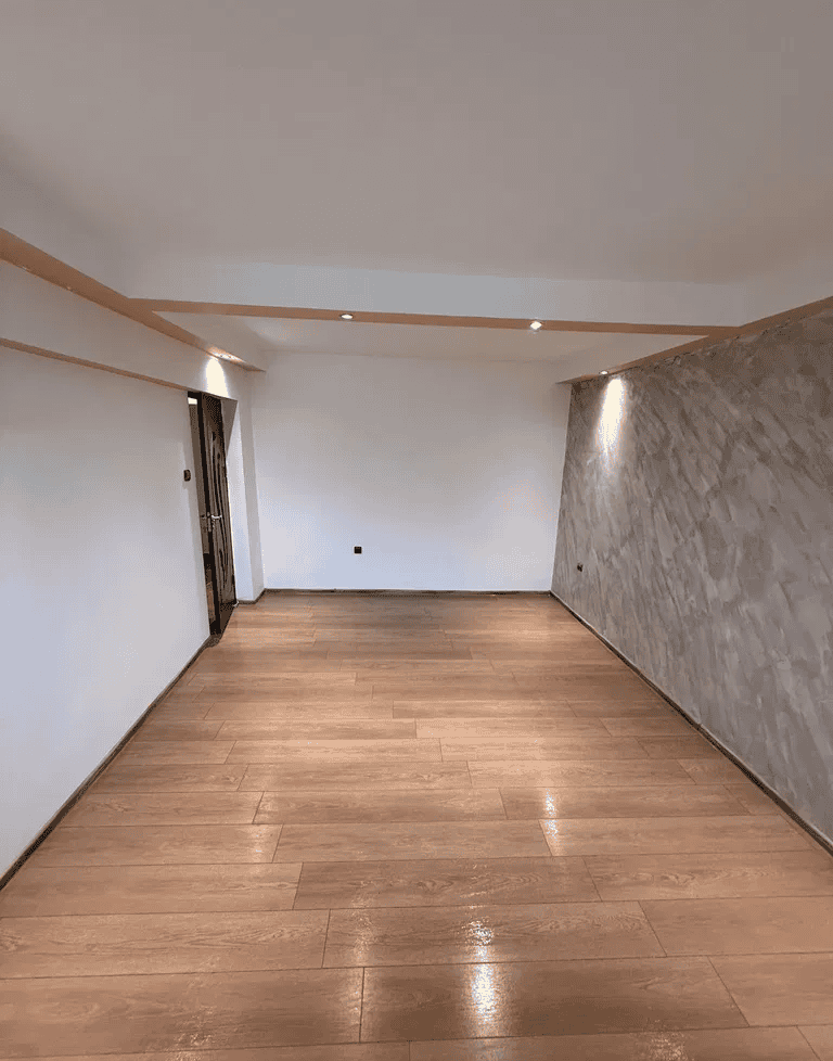 Camera captures a spacious, well-lit interior with contemporary decor.